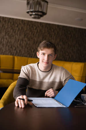 The guy with documentsの写真素材