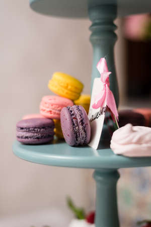 assorted macaroons on a stand, close-upの写真素材