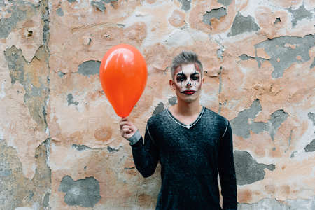 The hero to halloween in his image stands at the wallの写真素材