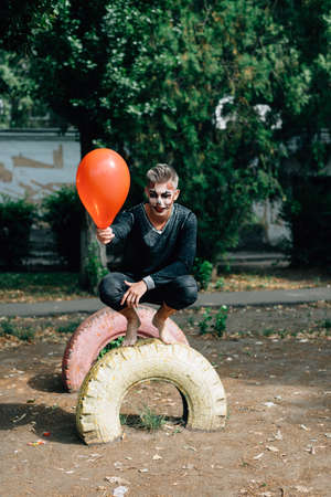 Day walk of a young guy in a park at a psychiatric clinicの写真素材