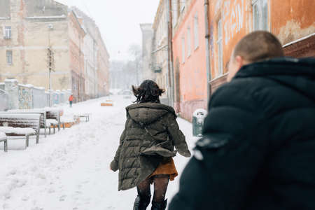 Young spouses enthusiastically play catch-up with each other.の写真素材