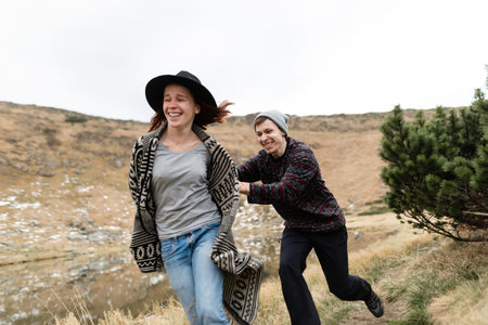 Childishness and happiness of two lovers. Happiness in the mountains.
