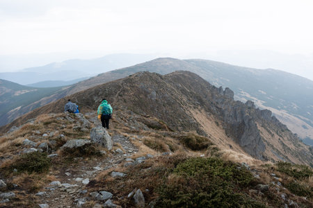 Camping group of tourists in the mountains. Journey through the rocks.