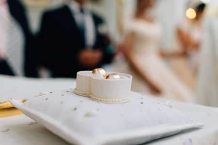 two gold rings lie next to each otherの写真素材