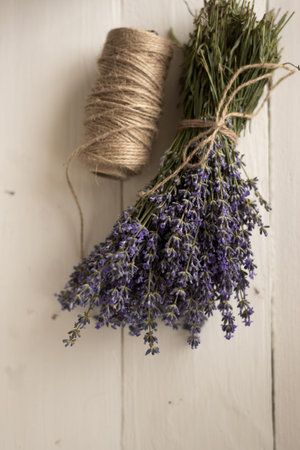 A brown decorative thread is bound to a fragrant bouquet of flowers. Photo of French Provence.