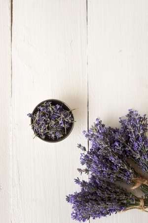 violet bouquets of fragrant lavender flowers with a piala on a white background. dried Provencal herbs. herbarium. organic matterの写真素材