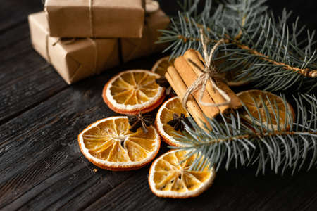Wooden table with Christmas decorations, dried orange slicesの写真素材