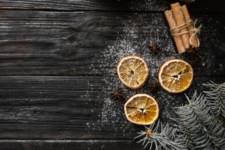 festive christmas background, orange lies on the table, fragrant spices anise and cinnamon