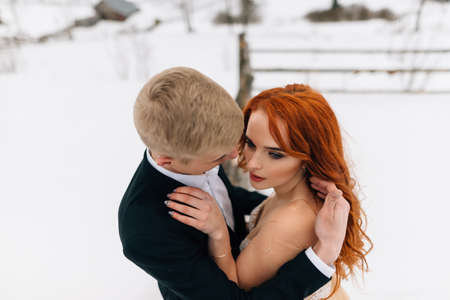 the best day, a wedding in the winter season, a beautiful couple, bride and groom, a tender embrace of youngの写真素材