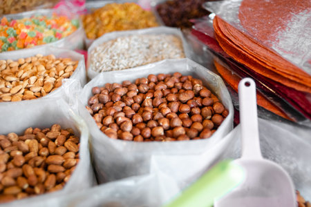 spontaneous market, cashews and walnuts on a shelf for sale at the indoor food market.