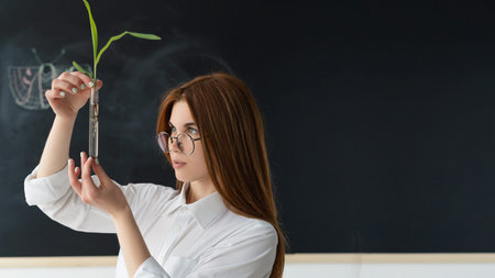In vitro plant. Which is studied by a girl with glasses and a white shirt. In the background is a...