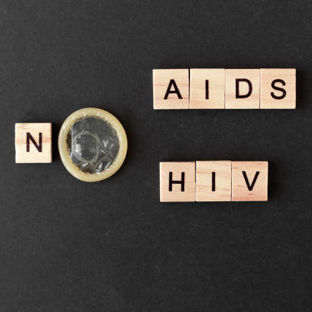 World AIDS Day. words from wooden letters no AIDS hiv. black backgroundの写真素材