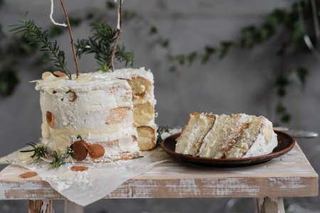 Festive background with birthday cake, piece of cake on a plate, happy birthday.の写真素材
