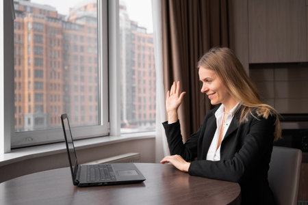 trainer psychologist conducts an online session on the Internet, remote work at home with a laptop, online consultations, psychologist doctorの写真素材