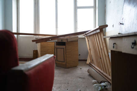 Empty evacuated deserted house apartment, empty abandoned destroyed room of the apartment. POV walk around the premisesの写真素材