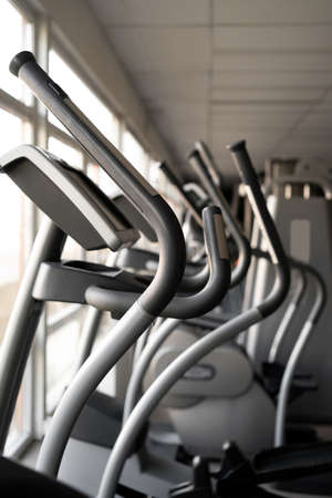 empty exercise equipment for cardio load in the gym without people.の写真素材