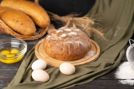 Delicious freshly baked bread on a rustic backgroundの写真素材