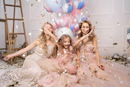 childrens party of daughter and mother, girls birthday 5 years old family together, holiday for child background of colored balloons, birthday celebrationの写真素材