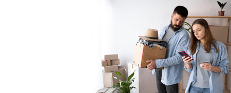 SME freelance woman hand holding credit card and smartphone with boxes, couple moving in new home,...