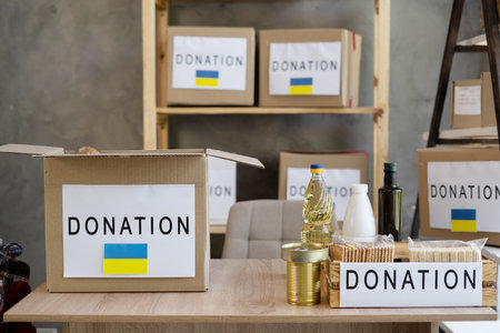 donation box of food for poor. Many foods in the package in volunteers charity center. Help for Ukraine. Donationの写真素材