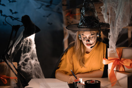Small business startup entrepreneur or freelance caucasian woman in witch costume, , online marketing packaging box and delivery, small and medium business concept. Halloween sale,の写真素材