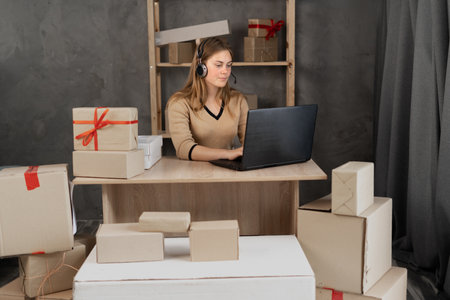 Startup small business entrepreneur or freelance woman using a laptop with box, success woman, online marketing packaging box and delivery, SME, e-commerceの写真素材