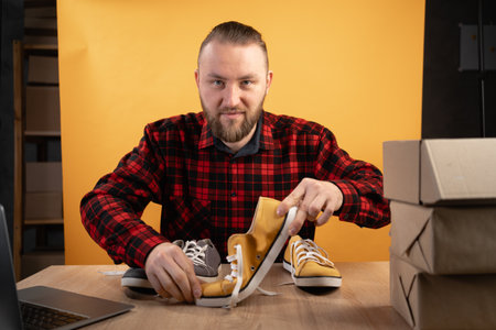 Micro influencer man record live viral video at home studio. Blogger man talking and advice product of internet store, review in social media. Vlogger recording video for marketing in social mediaの写真素材