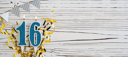 Number 16 blue celebration candle on white wooden background. happy birthday candles. Concept of celebrating birthday, anniversary, important date, holiday. copyspace. Bannerの写真素材