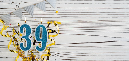 Number 39 blue celebration candle on white wooden background. happy birthday candles. Concept of celebrating birthday, anniversary, important date, holiday. copyspace. Bannerの写真素材