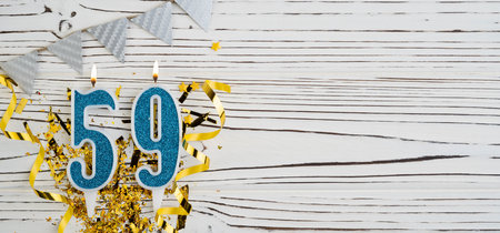 Number 59 blue celebration candle on white wooden background. Happy birthday for fifty-nine years old. Copy space.の写真素材