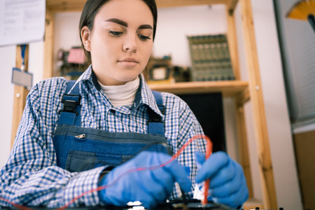 Technician check problem of laptop computer with multimeter, close up. Computer repair and upgradeの写真素材