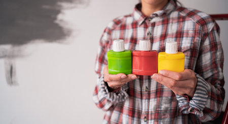 Hands of house painter woman decorator choose the color dye, work of the house to renovate, close up. Renovationの写真素材