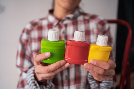 Hands of house painter woman decorator choose the color dye, work of the house to renovate, close up. Renovationの写真素材
