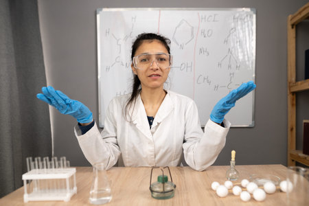 Happy woman blogger applicant teacher at home office record vlog teaching chemistry on webinar in...