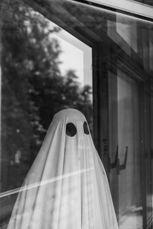 Ghost in abandoned, haunted house. Horror scene of spirit of a man, Halloween concept.の写真素材