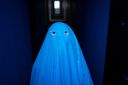 Ghost costume out of a sheet with eye holes cut out, close-up