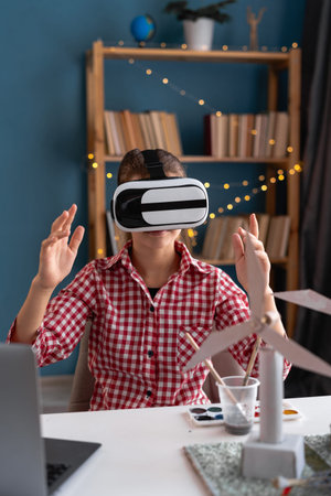 Student girl using augmented reality application in virtual reality glasses on site at project with...