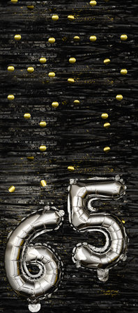 Silver foil balloon number 65 on a background of black tinsel with gold confetti. Birthday card,...