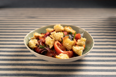 Traditional Italian salad Panzanella with tomatoes and bread croutons