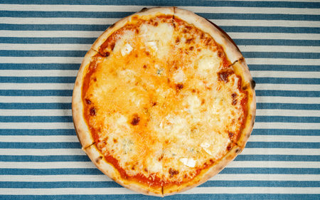 Italian pizza four cheese, formaggio, Italian pizzeria concept. Variety of flavorsの写真素材