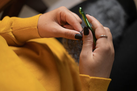 Hobby knitting and needlework. Girl knitting at home. Handmade zero waste. small businessの写真素材