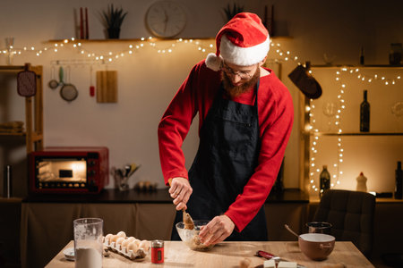 homemade baking. Man preparing dough for gingerbread cookies for christmas in the kitchen