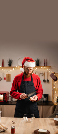 Bearded man preparing Christmas cookie dough recipeの写真素材