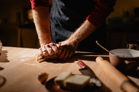 Merry Christmas. Gingerbread cooking. Close-up of man making dough for gingerbread cookies. Xmas...
