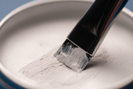 White paste and brush for marking the shape of the eyebrows, close-up. Professional makeup and facial care.の写真素材