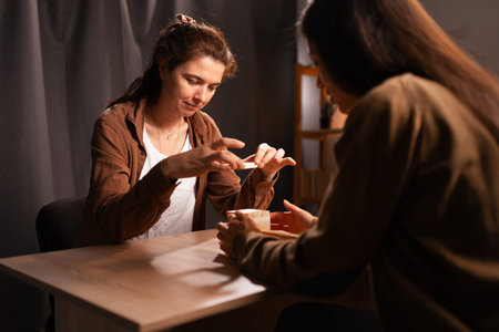 Women playing building wooden block tower