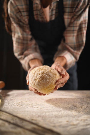 Close-Up of Baker Holding Fresh Doughの写真素材