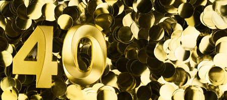 Golden number forty candle on shiny yellow confetti background. Festive backdrop for fortieth birthday, anniversary or celebration. Bright greeting card with space for text.の写真素材
