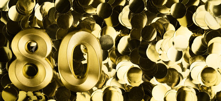 Golden number eighty 80 candle on shiny yellow confetti background. Festive backdrop for eightieth birthday, anniversary, or celebration. Bright greeting card with space for text.の写真素材