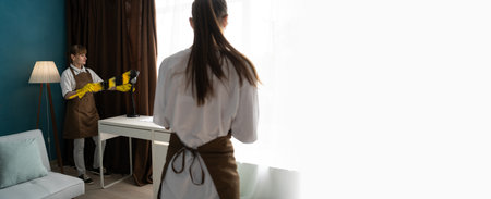 Housekeeping team cleaning the living room. Concept of housecleaningの写真素材